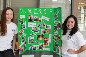 Two students pose with their Panhellenic poster